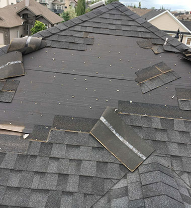 In progress asphalt tile roofing on a Salt Lake County house