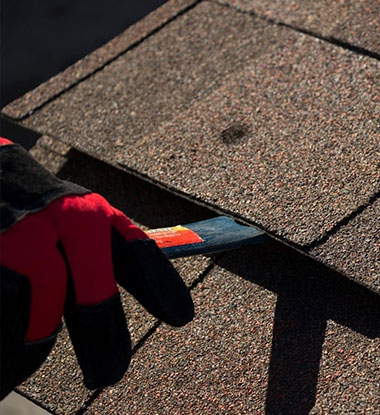Shingle repair in progress on a Utah County residential roof