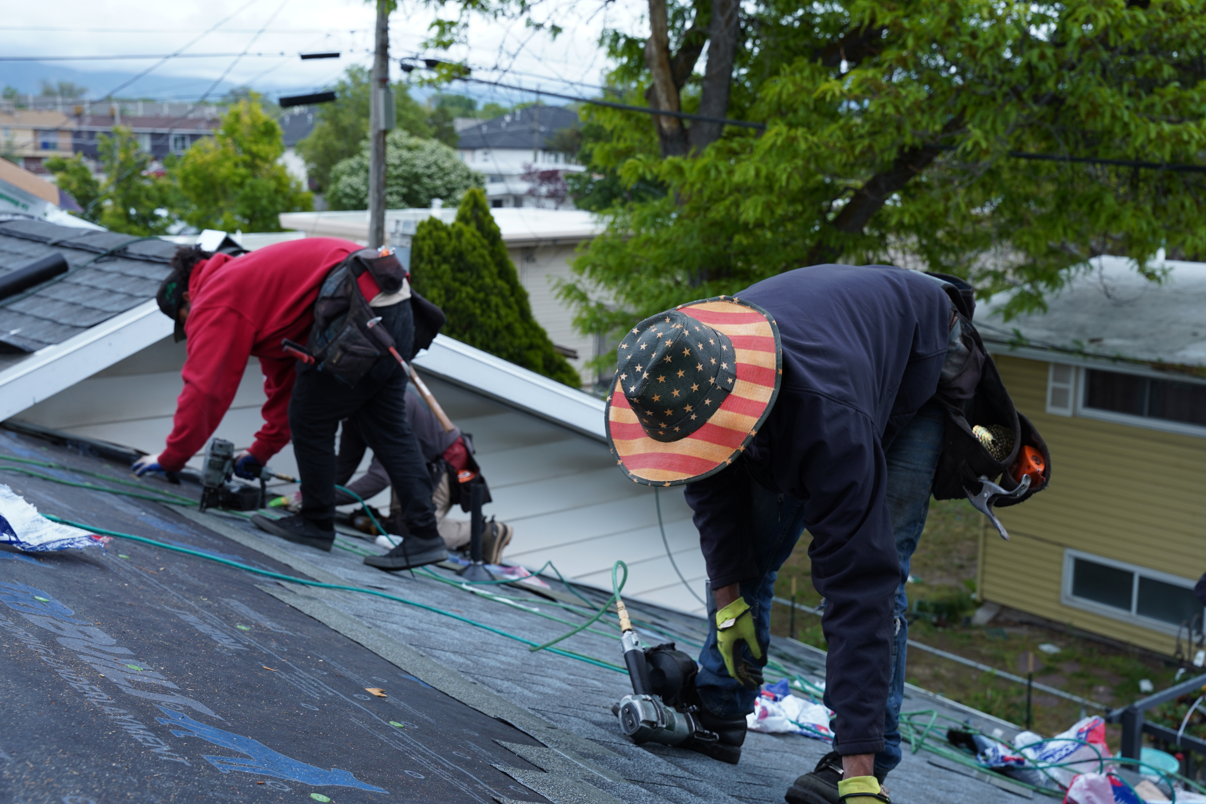 professionals installing GAF shingles on a roof in salt lake county