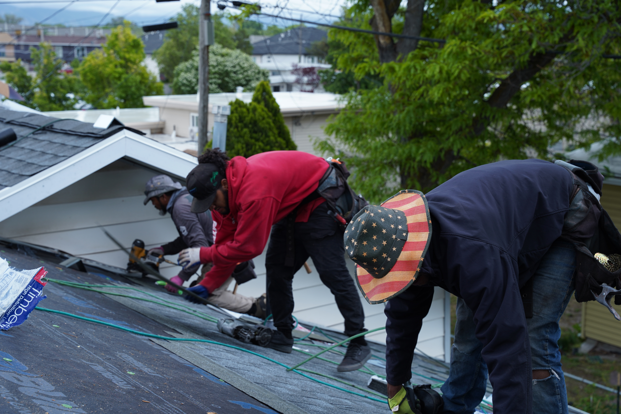 roofing contractors repairing a roof in salt lake county