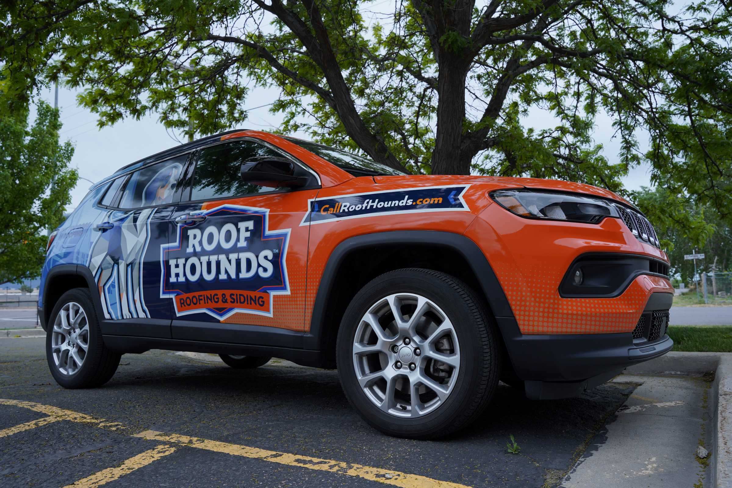 a Roof Hounds vehicle for roofing services in Utah County